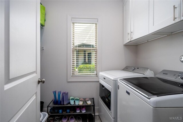 11210 Davis Pl, Northport, AL 35475 - washroom with washer and dryer, healthy amount of natural light, and cabinet space