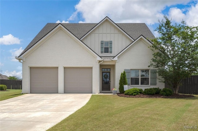 11210 Davis Pl, Northport, AL 35475 - view of front facade with board and batten siding, concrete driveway, brick siding, and roof with shingles
