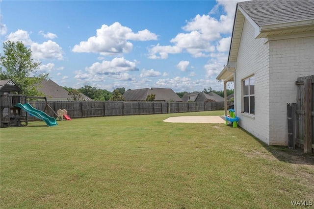 11210 Davis Pl, Northport, AL 35475 - fenced backyard with a playground and a patio