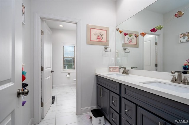 11210 Davis Pl, Northport, AL 35475 - full bathroom featuring marble look tile flooring and double vanity