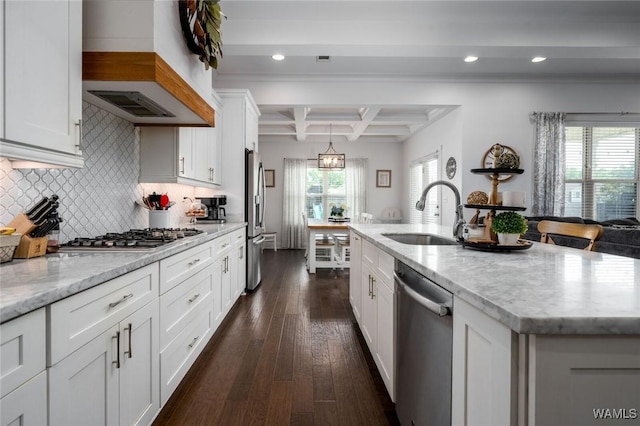 11210 Davis Pl, Northport, AL 35475 - kitchen with stainless steel appliances, custom range hood, coffered ceiling, dark wood finished floors, and white cabinetry