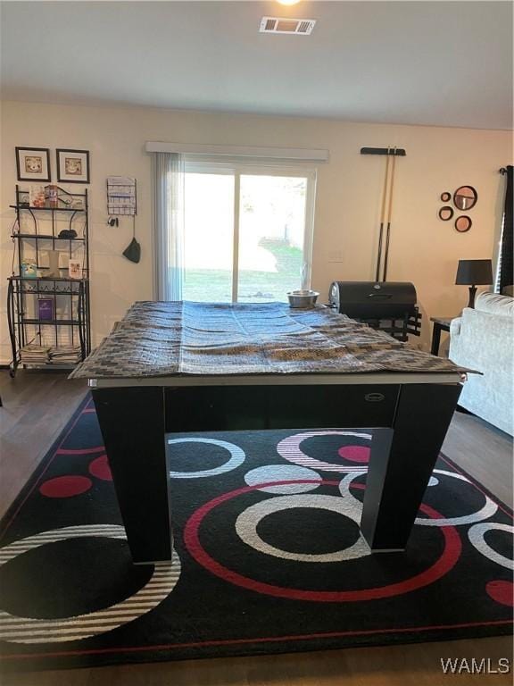 dining space with dark hardwood / wood-style flooring