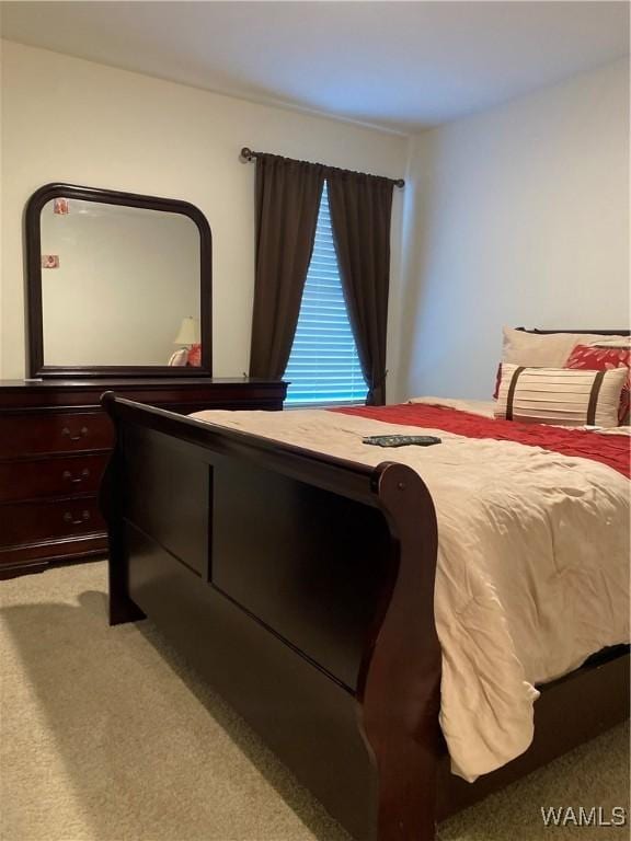 bedroom with light colored carpet