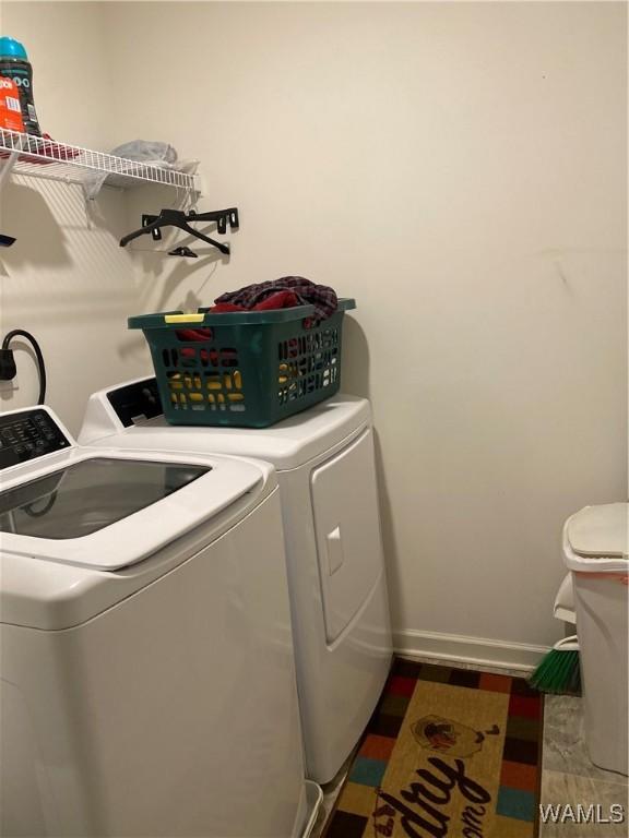 washroom with washing machine and clothes dryer