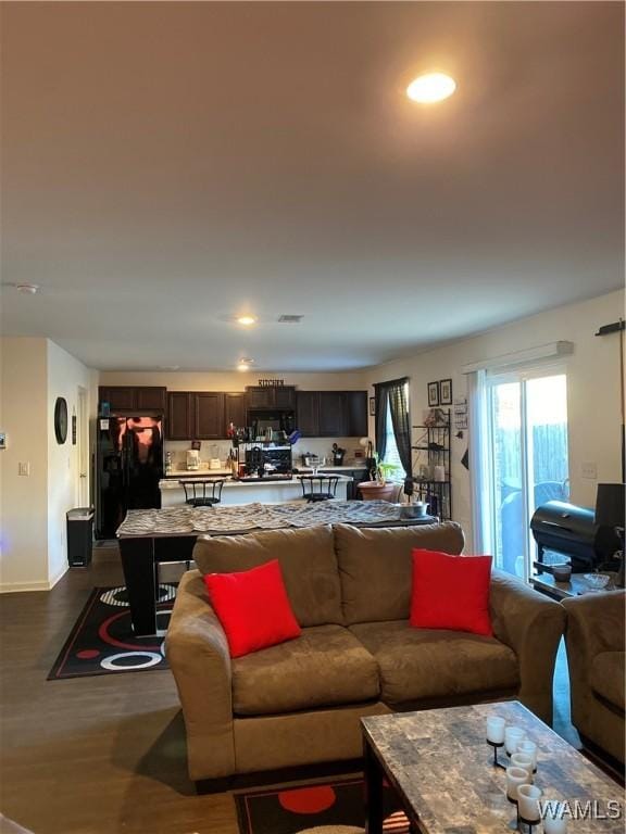 living room featuring dark hardwood / wood-style flooring