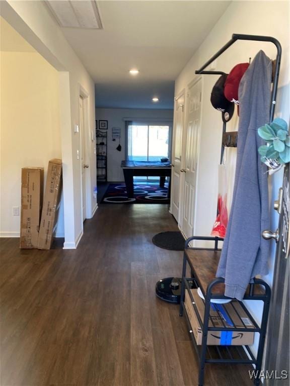 corridor featuring dark hardwood / wood-style flooring