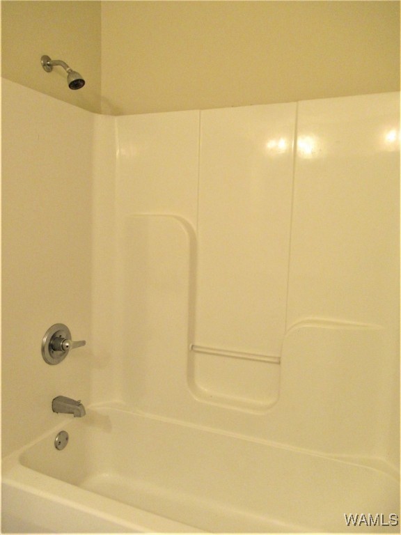 bathroom with shower / tub combination