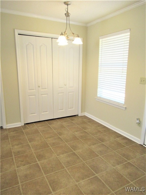 interior space featuring a chandelier and ornamental molding