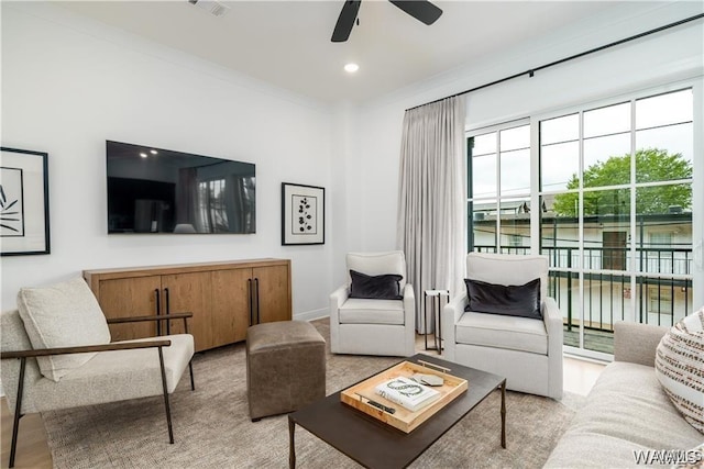 living room with ceiling fan and light hardwood / wood-style floors