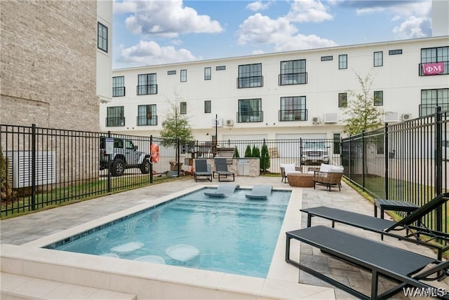 view of pool featuring a patio