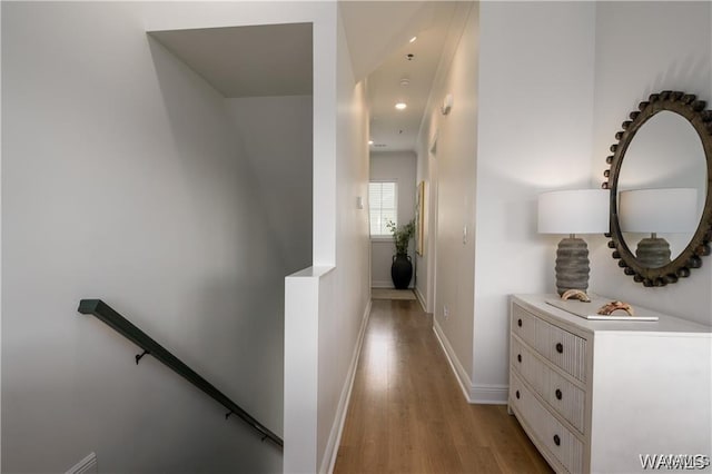 corridor with light hardwood / wood-style flooring