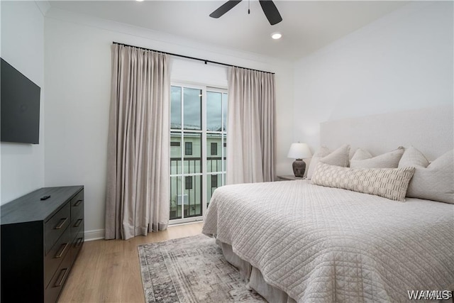 bedroom featuring ceiling fan, light hardwood / wood-style flooring, and crown molding