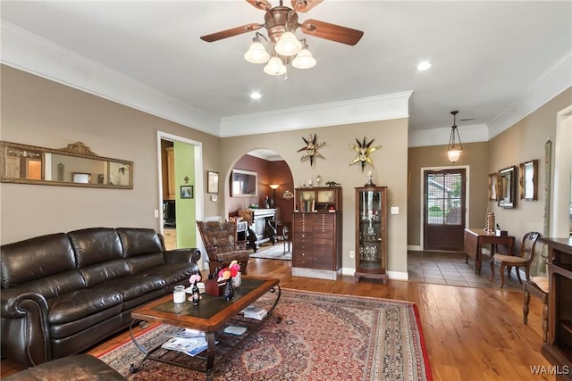 10035 Empress Blvd, Tuscaloosa, AL 35405 - living room featuring arched walkways, a ceiling fan, wood finished floors, and ornamental molding