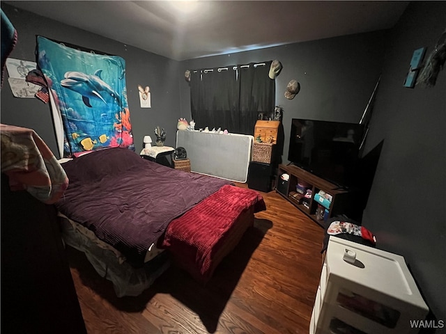 bedroom featuring hardwood / wood-style flooring