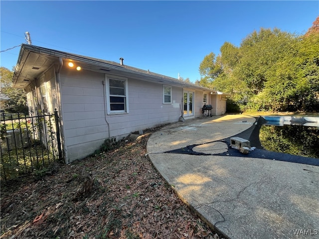 back of property with a patio