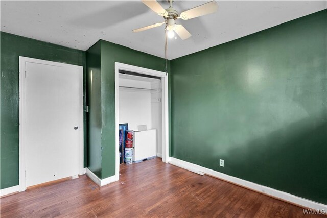 bedroom with dark wood-type flooring