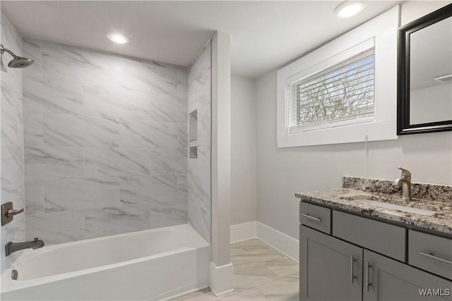 bathroom with marble finish floor, recessed lighting, washtub / shower combination, vanity, and baseboards