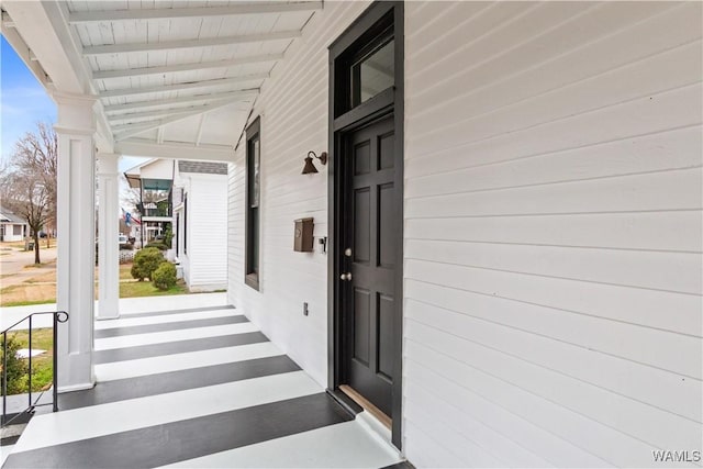 entrance to property featuring a porch