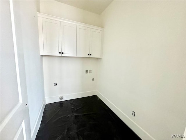 laundry area featuring hookup for a washing machine and cabinets