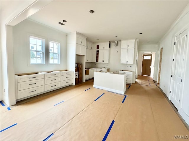 kitchen with white cabinetry and a kitchen island