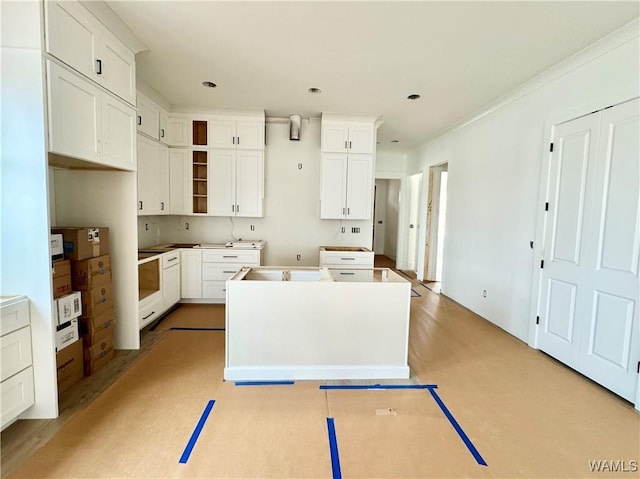 kitchen with white cabinetry and a kitchen island