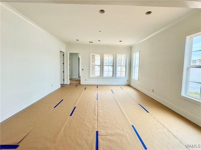 spare room with ornamental molding and basketball hoop