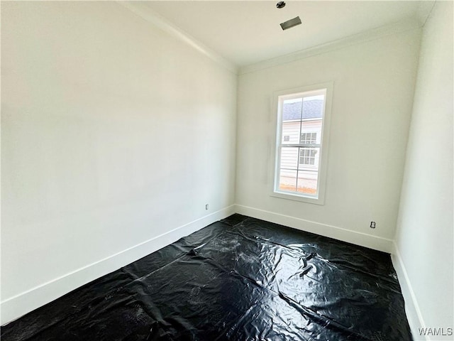 unfurnished room featuring ornamental molding