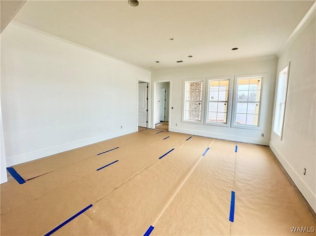 empty room featuring crown molding and basketball court