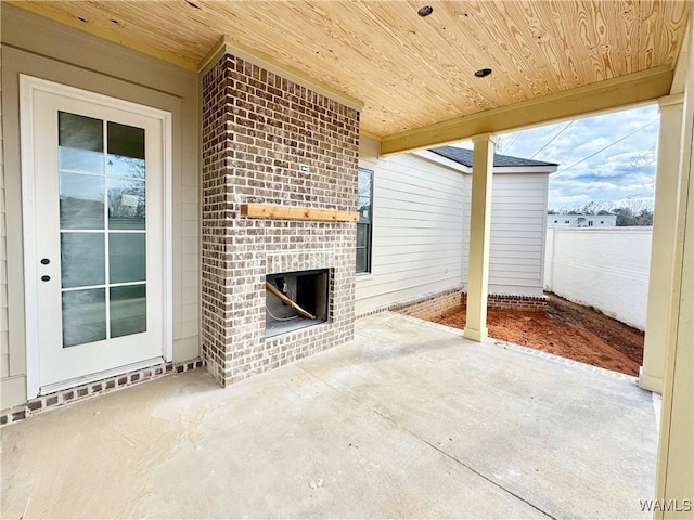 view of patio / terrace with an outdoor brick fireplace