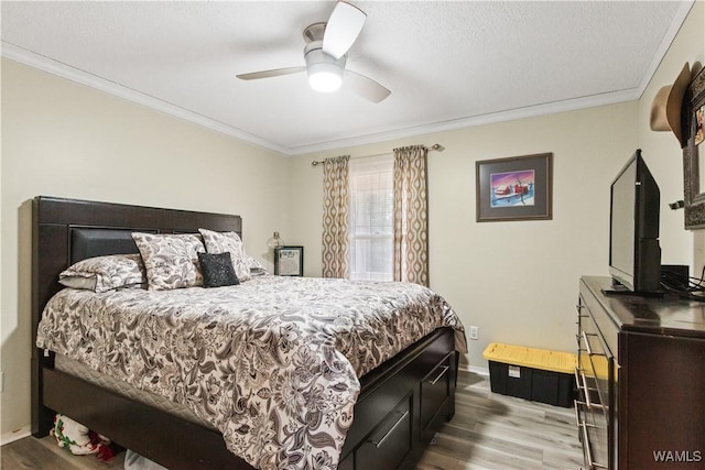 15551 Oakwood Dr, Brookwood, AL 35444 - bedroom featuring ornamental molding, wood finished floors, and ceiling fan