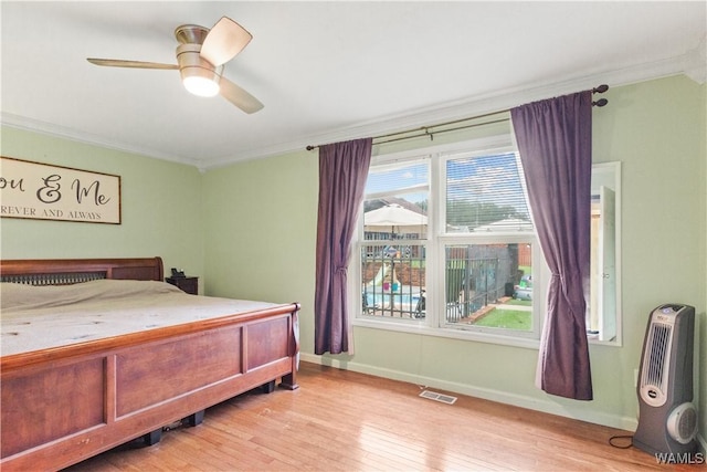 15551 Oakwood Dr, Brookwood, AL 35444 - bedroom featuring crown molding, light wood-type flooring, and a ceiling fan