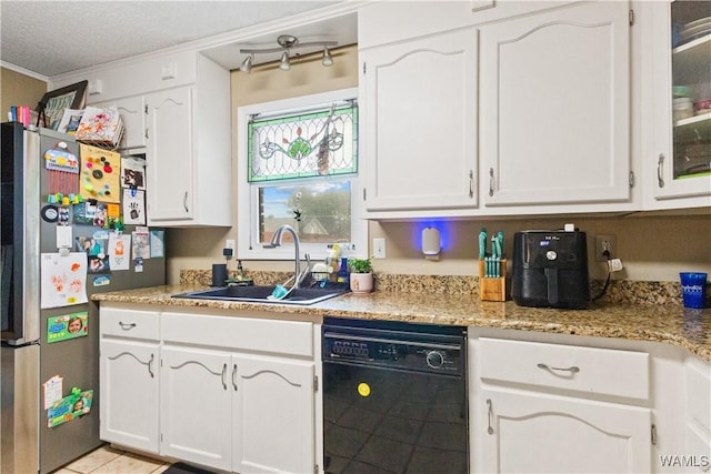 15551 Oakwood Dr, Brookwood, AL 35444 - kitchen featuring black dishwasher, freestanding refrigerator, white cabinetry, crown molding, and a textured ceiling