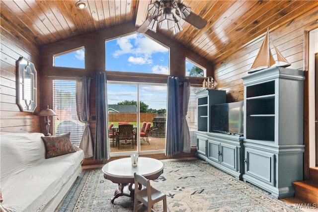 15551 Oakwood Dr, Brookwood, AL 35444 - living area featuring wood walls, a wooden ceiling with exposed beams, ceiling fan, wood finished floors, and high vaulted ceiling