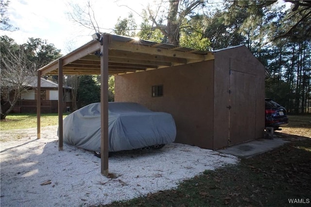 view of vehicle parking featuring a carport