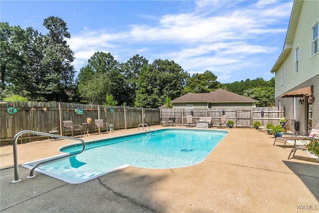 view of pool with a patio area