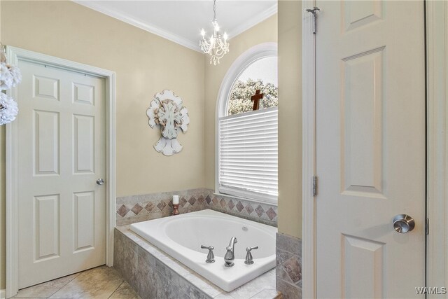 bathroom featuring tiled tub, crown molding, tile patterned flooring, and a notable chandelier