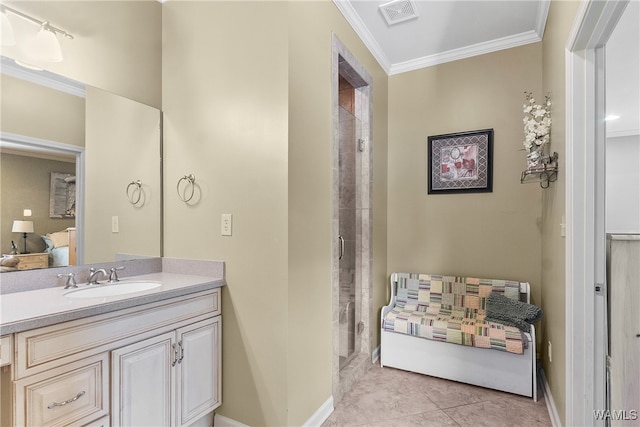 bathroom featuring tile patterned floors, crown molding, vanity, and a shower with shower door