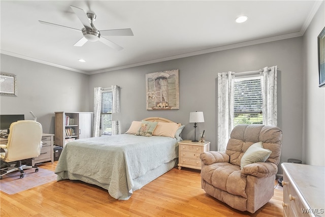 bedroom with ceiling fan, ornamental molding, and light wood-type flooring