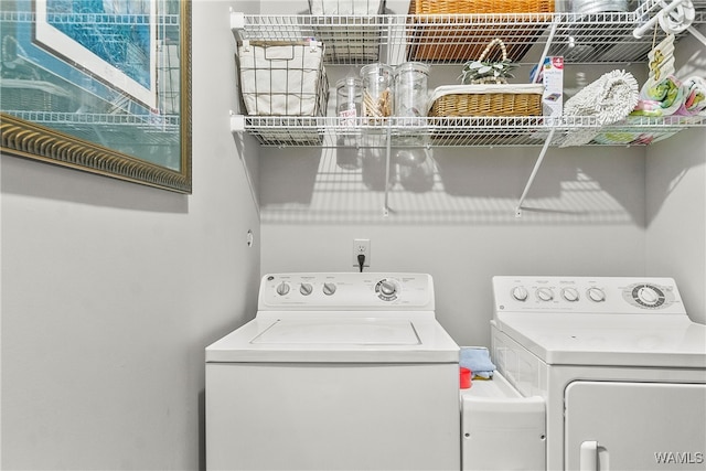 washroom featuring independent washer and dryer