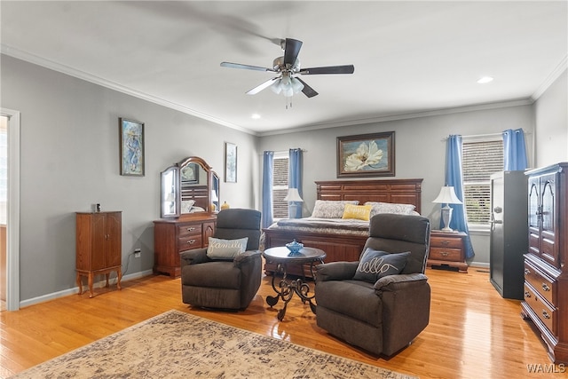 bedroom featuring ceiling fan, light hardwood / wood-style flooring, and ornamental molding