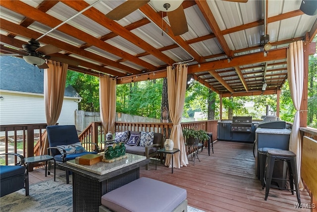 wooden terrace featuring an outdoor living space, ceiling fan, and grilling area