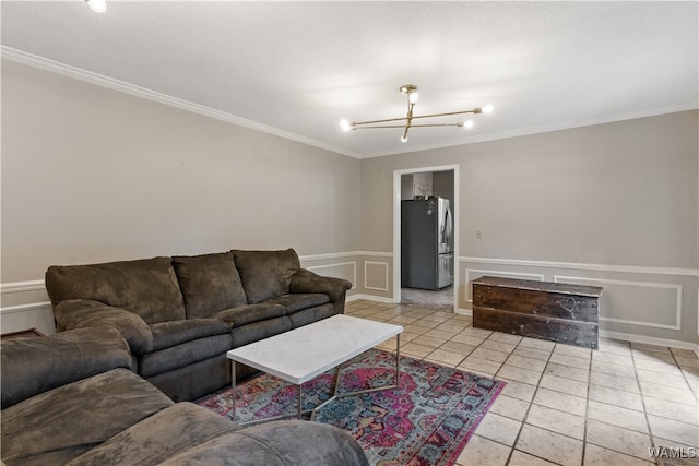 living room with a chandelier, light tile patterned floors, and crown molding