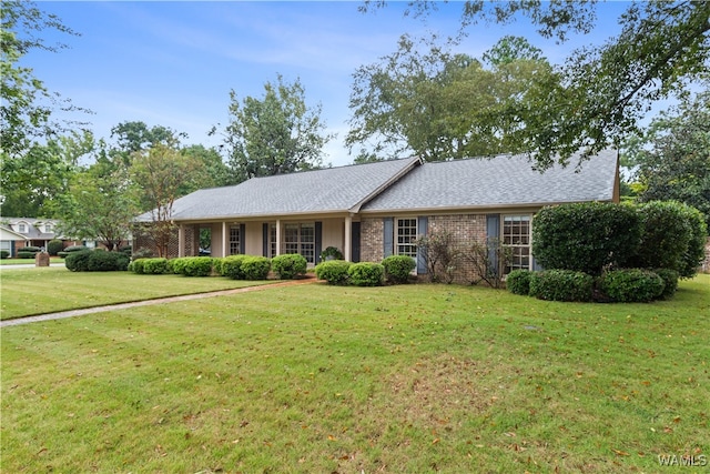 single story home featuring a front yard