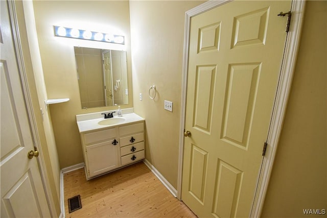 bathroom featuring vanity and hardwood / wood-style flooring