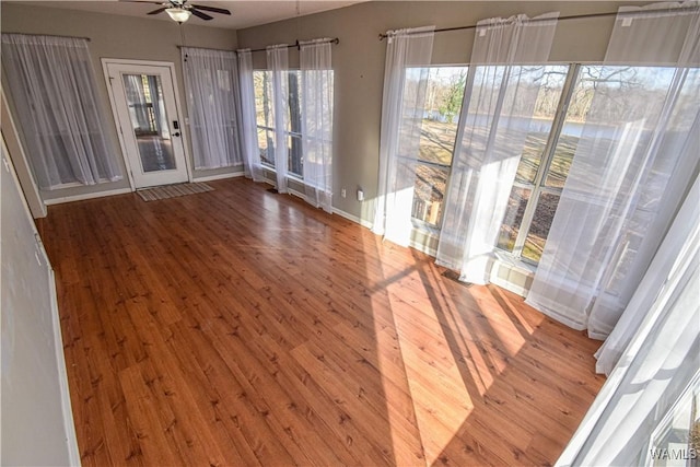 interior space featuring ceiling fan and wood-type flooring