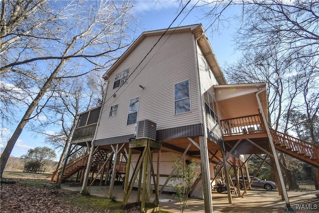 rear view of property with a sunroom