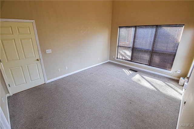 unfurnished room featuring carpet flooring