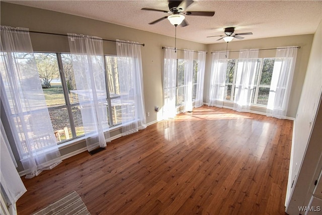 interior space with ceiling fan