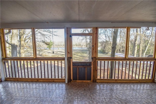 unfurnished sunroom with a wealth of natural light