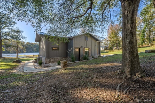 view of side of property with a water view